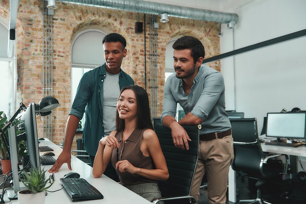 Young professional woman taking a risk by taking on a new project at work and gaining confidence because of it.