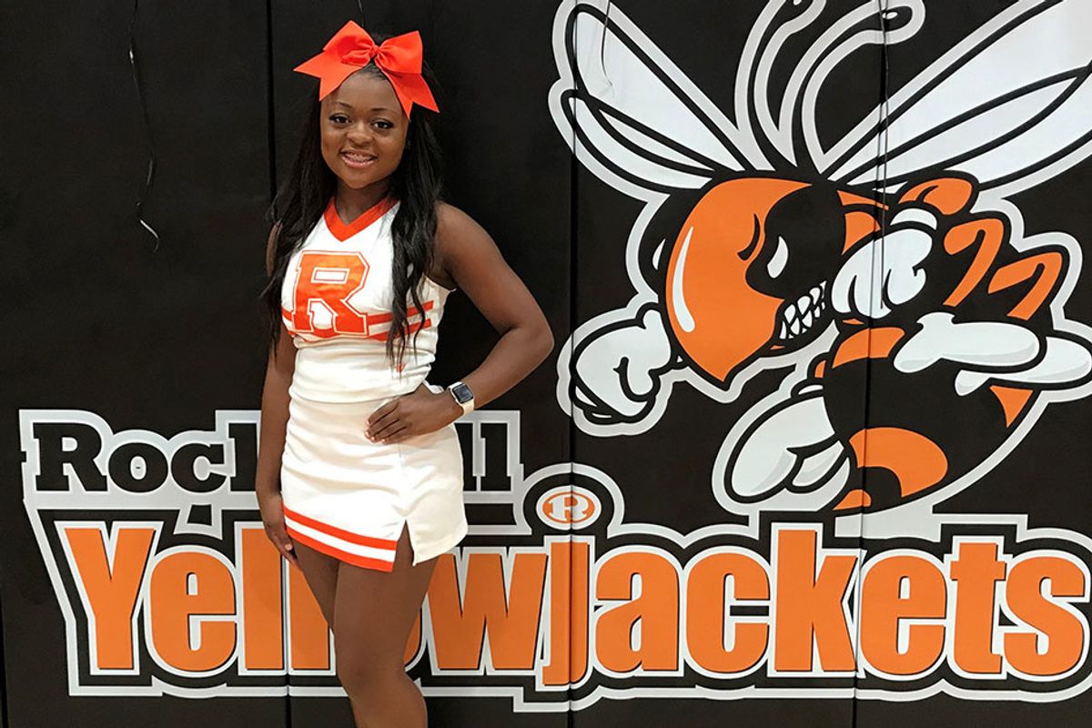 A high school cheerleader jumped off her parade float to save a choking toddler's life