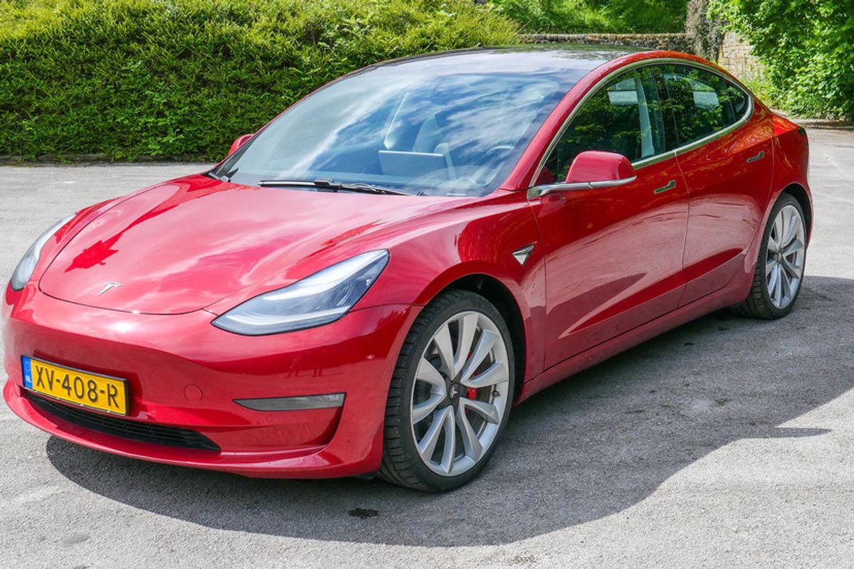 Photo of a red Tesla Model 3 Performance
