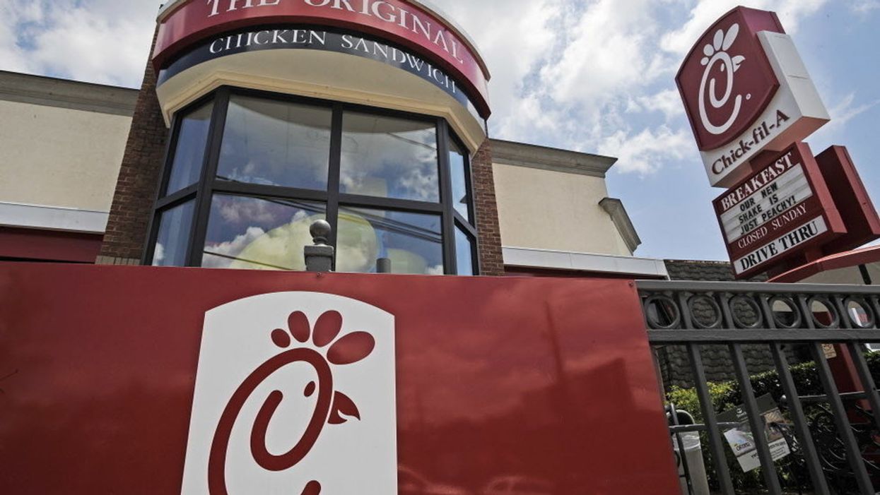 Chick-fil-A employee climbs down manhole to retrieve a woman's phone