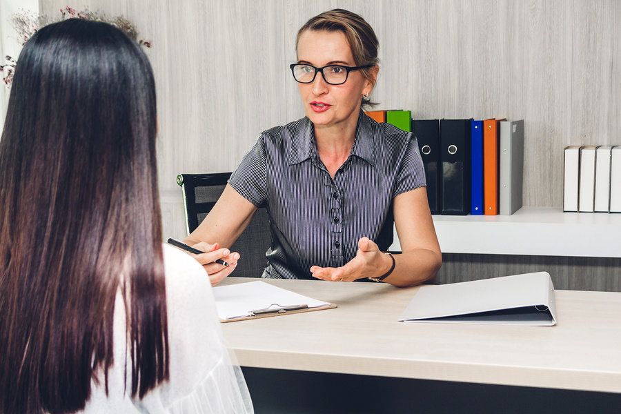 Manager goes over her employee's career objectives.