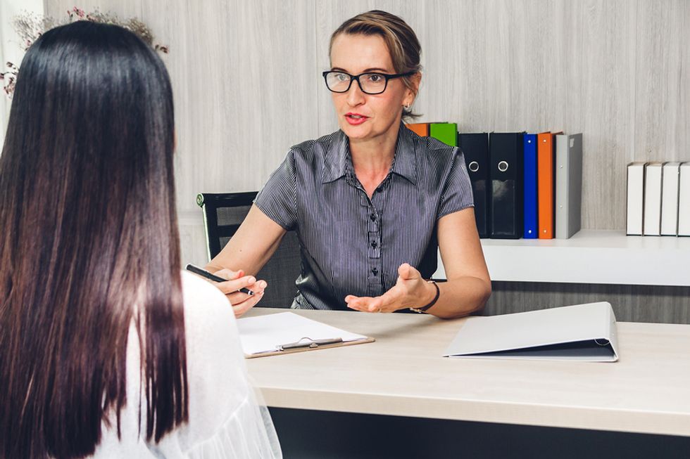 Manager goes over her employee's career objectives.
