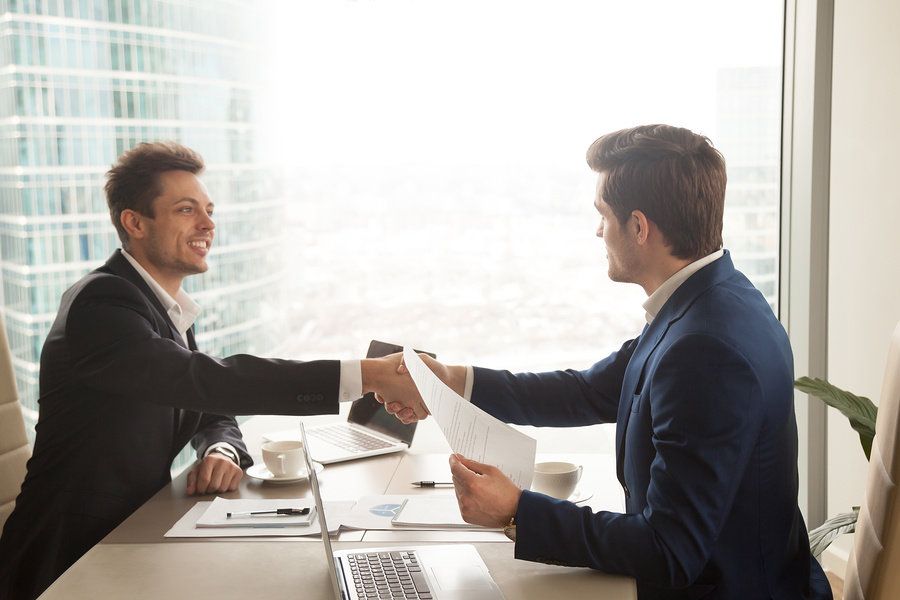Young professional talking about one of his greatest achievements in a job interview