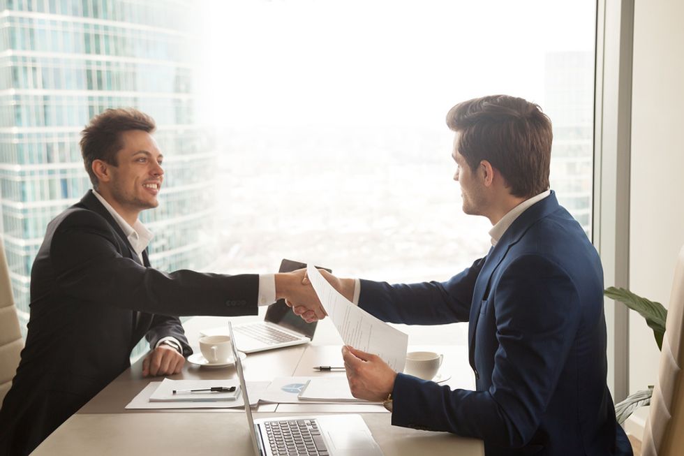 Young professional talking about one of his greatest achievements in a job interview