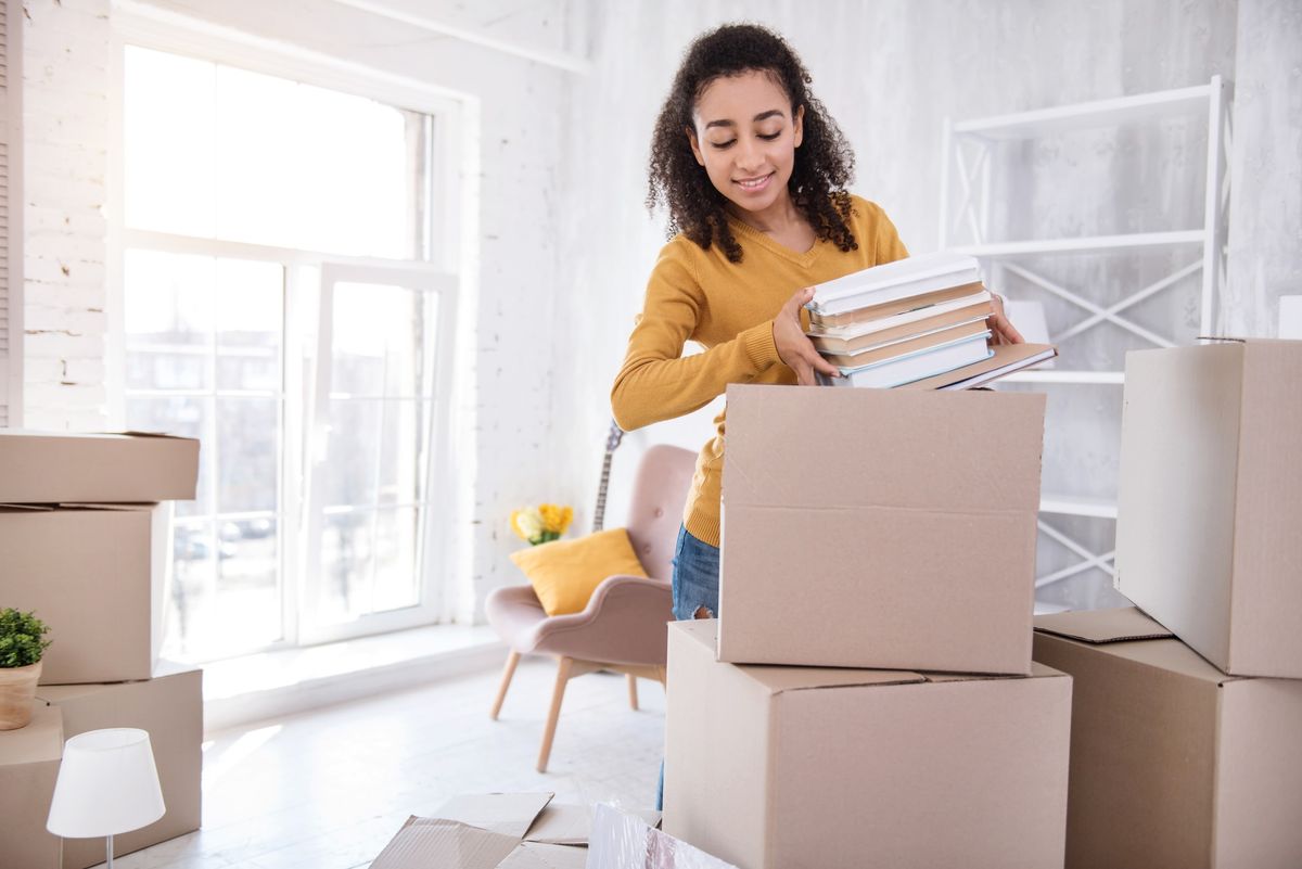 College student loading boxes