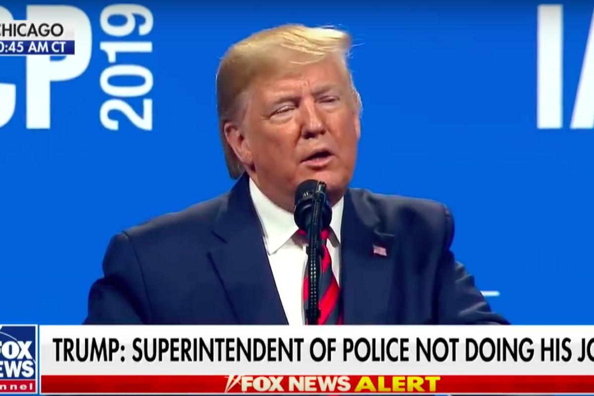 Trump Insults Chicago At Police Chief Conference, Puts Ketchup On Hot Dog