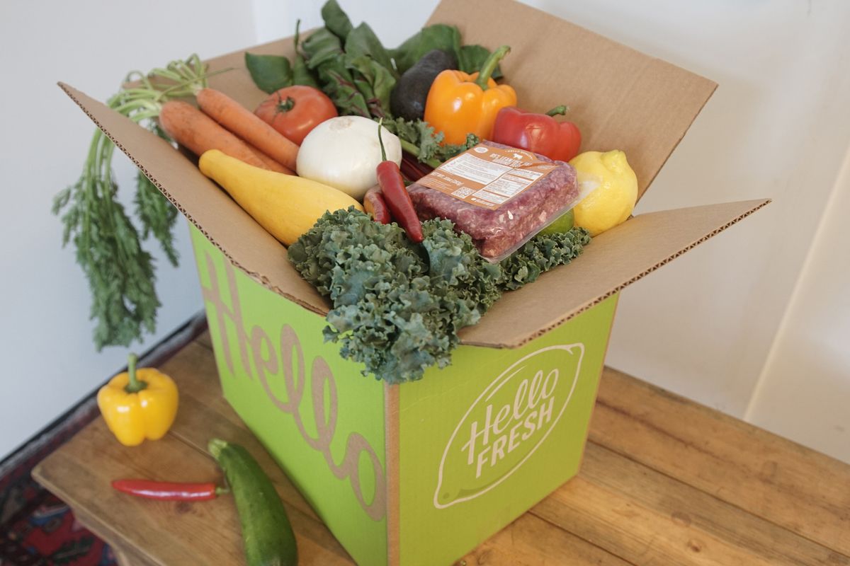 Hellofresh box open on a table with ingredients showing