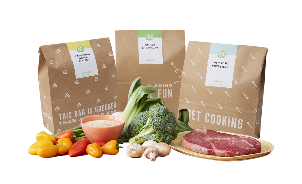 3 Hellofresh bags with ingredients out in front