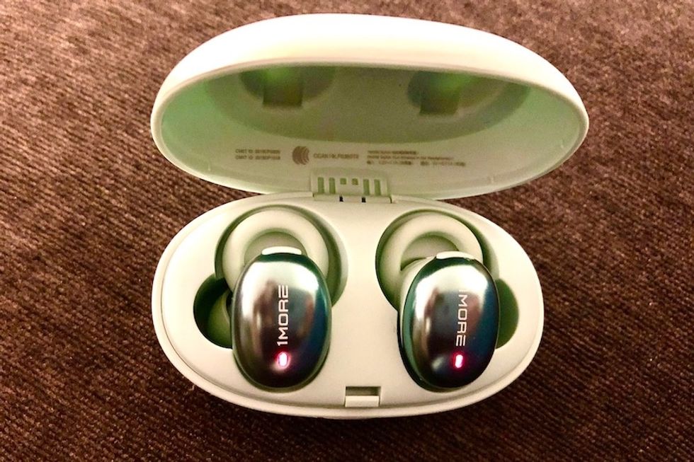 A pair of 1More Stylish True Wireless In-Ear Headphones in their charging case