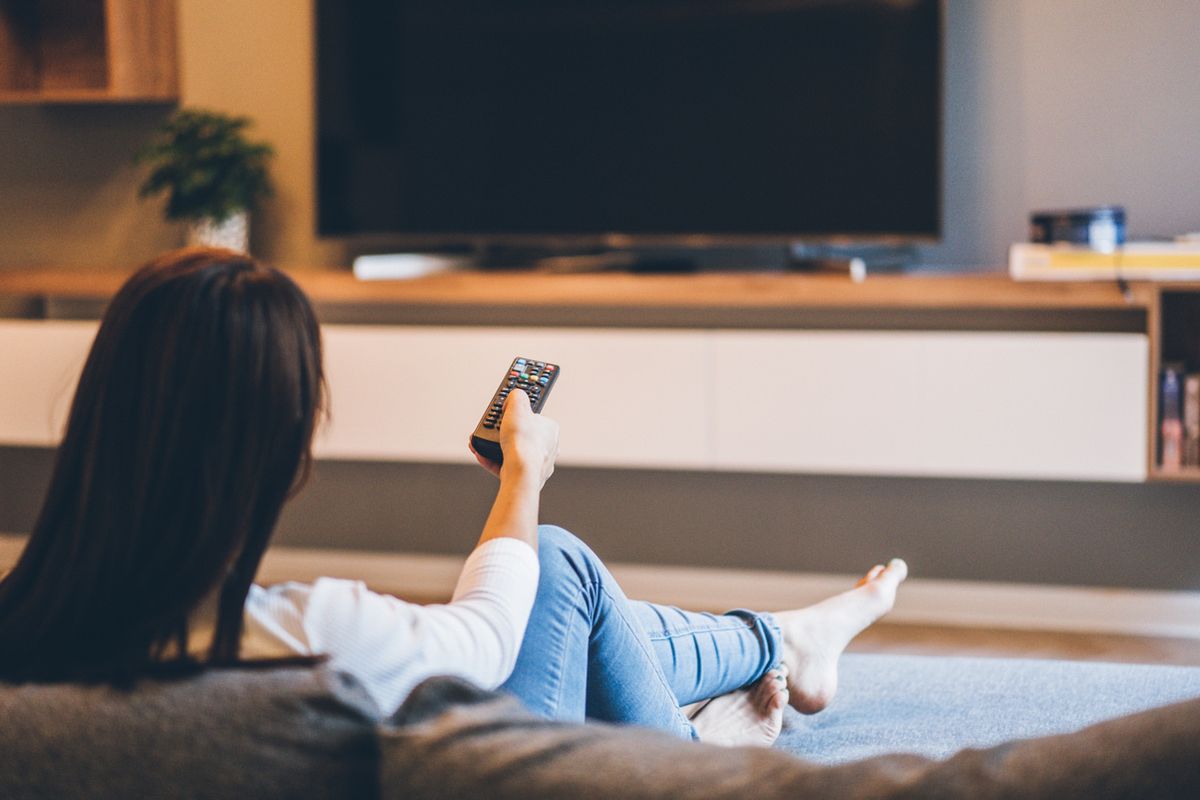 Stock image of a woman watching TV