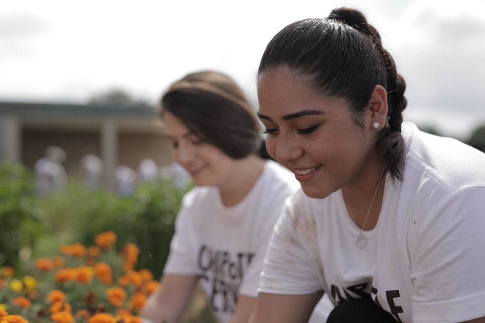Chipotle employees work at a recent community service project.