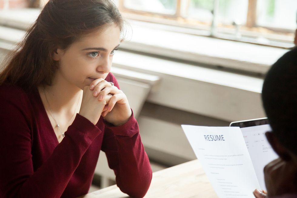 Young woman and HR manager discuss the next steps after she is rejected from a job she applied to.