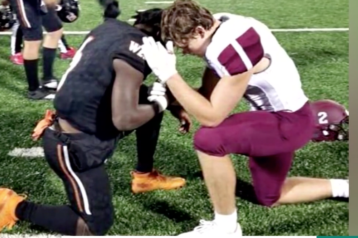 These two high-school football players are going viral for praying together after a game