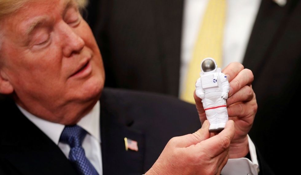 Trump with astronaut toy