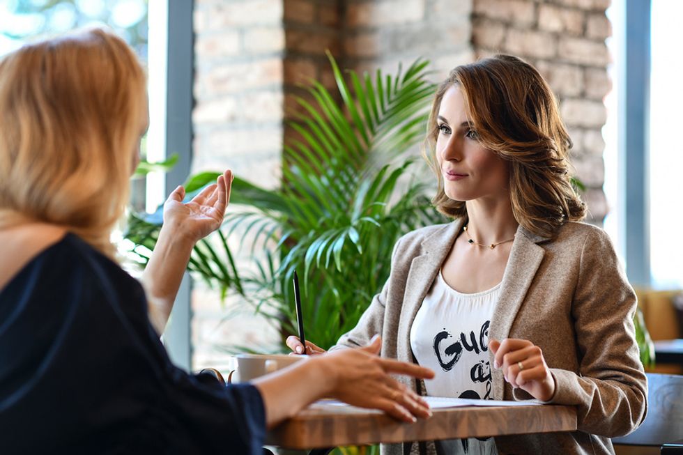 Recently laid off women networking at a local cafe