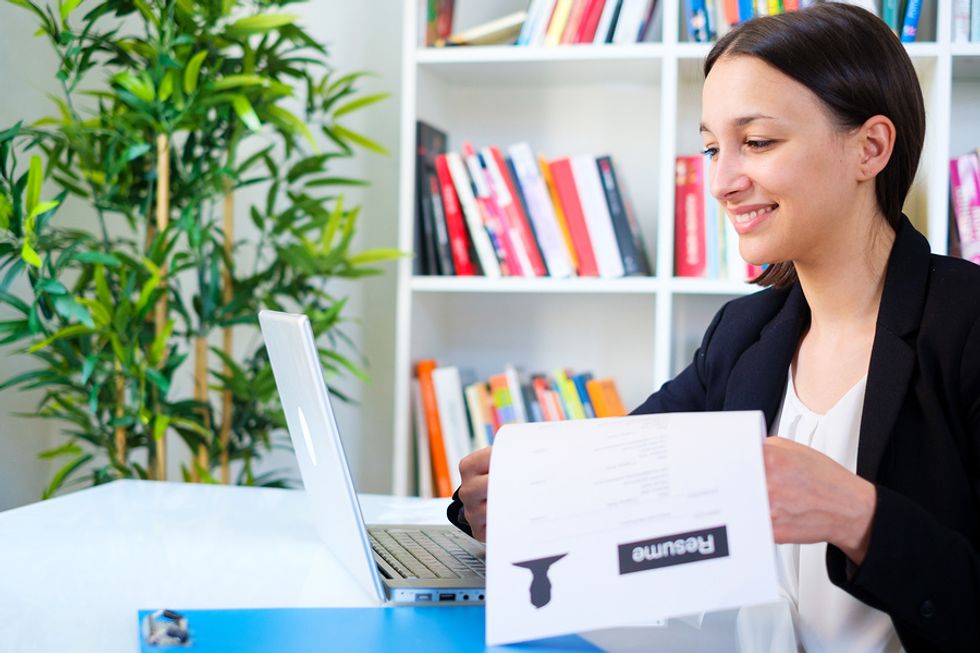 Young professional updates her resume.