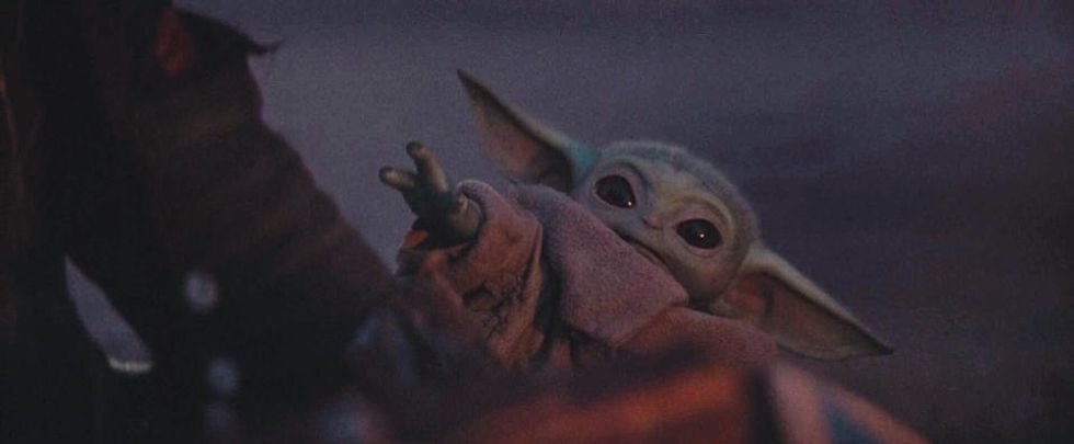 Baby Yoda reaching out