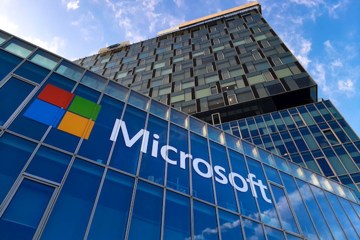 The Microsoft logo as seen from the street on a glass building