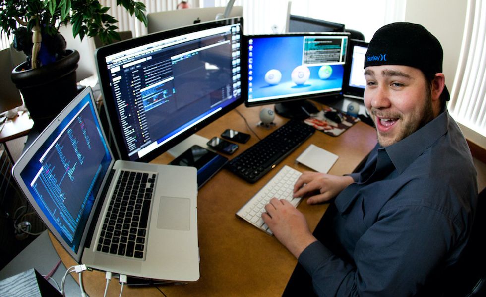 Sphero's Adam Wilson in front of his bank of computers