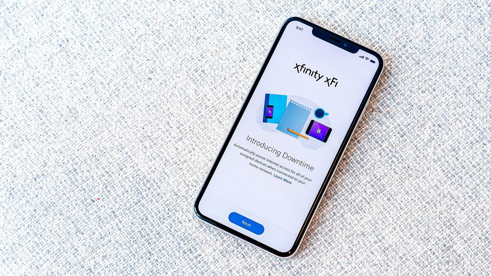 Photo of smartphone with xfinity xfi app home screen