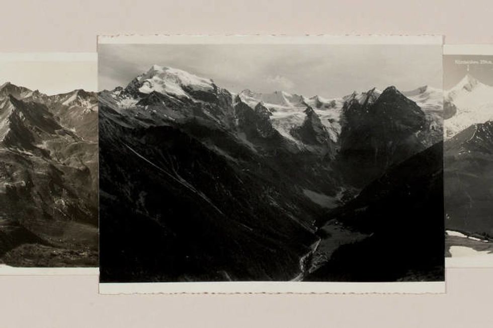 This black and white image shows a mountain range.