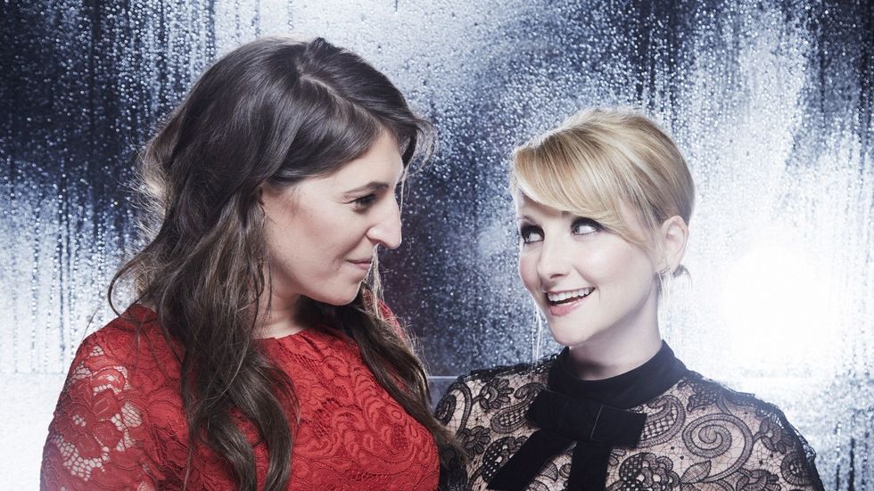 Mayim Bialik and Melissa Rauch smiling at each other