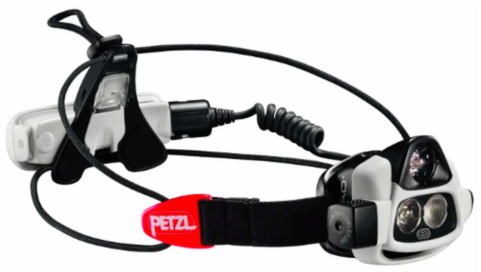 A headlamp from Petzl with black cables and white and red details