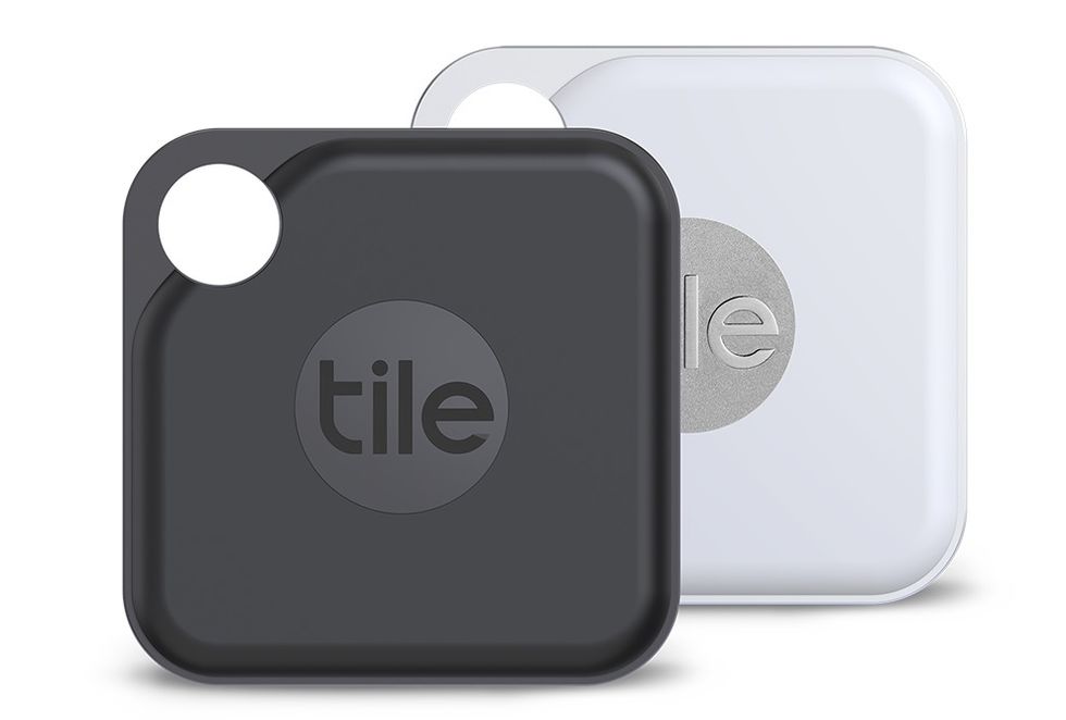 Two Tile Pro trackers, one in black and one in white
