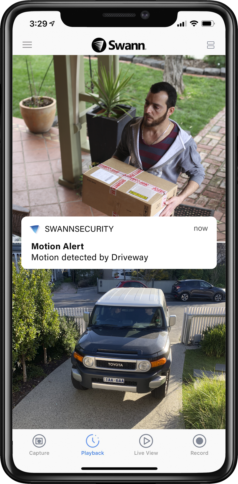Picture of smartphone with Swann app showing motion alert from video from swann security camera