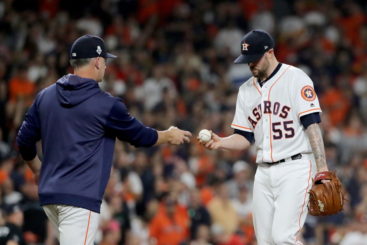 A.J. Hinch takes the ball from Ryan Pressly