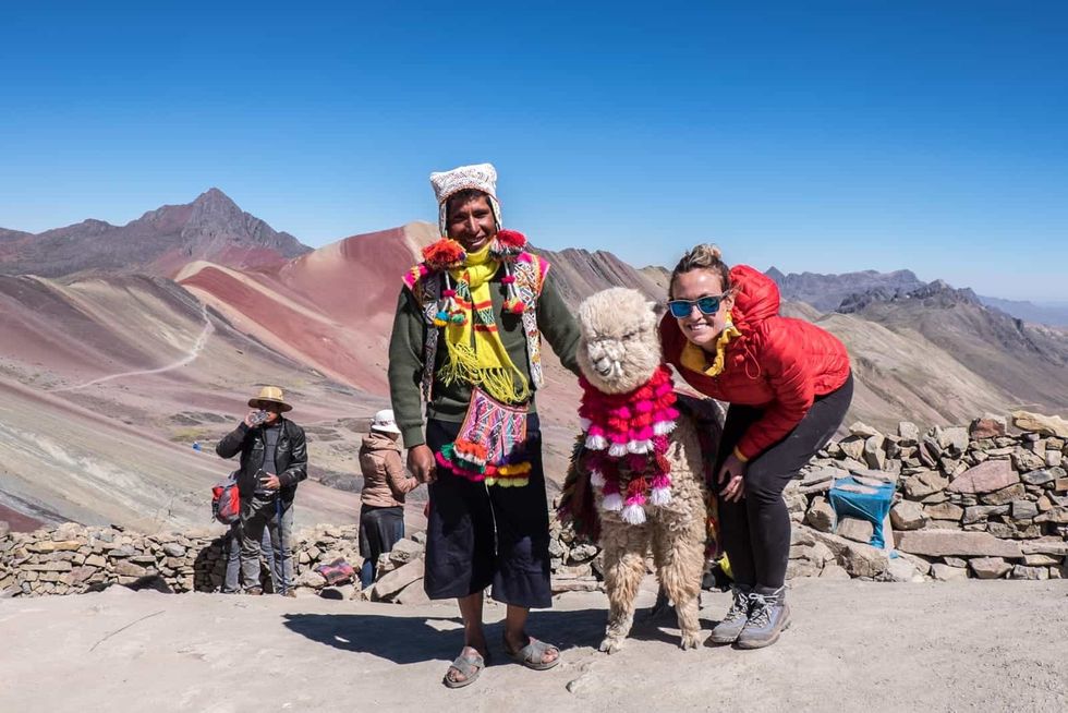 Tourist Posing With A Llama in Peru