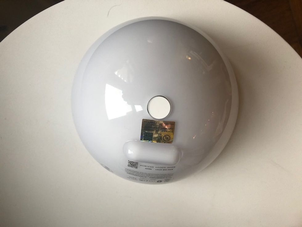 The back of the Philips Hue Go lamp with a lip or edge