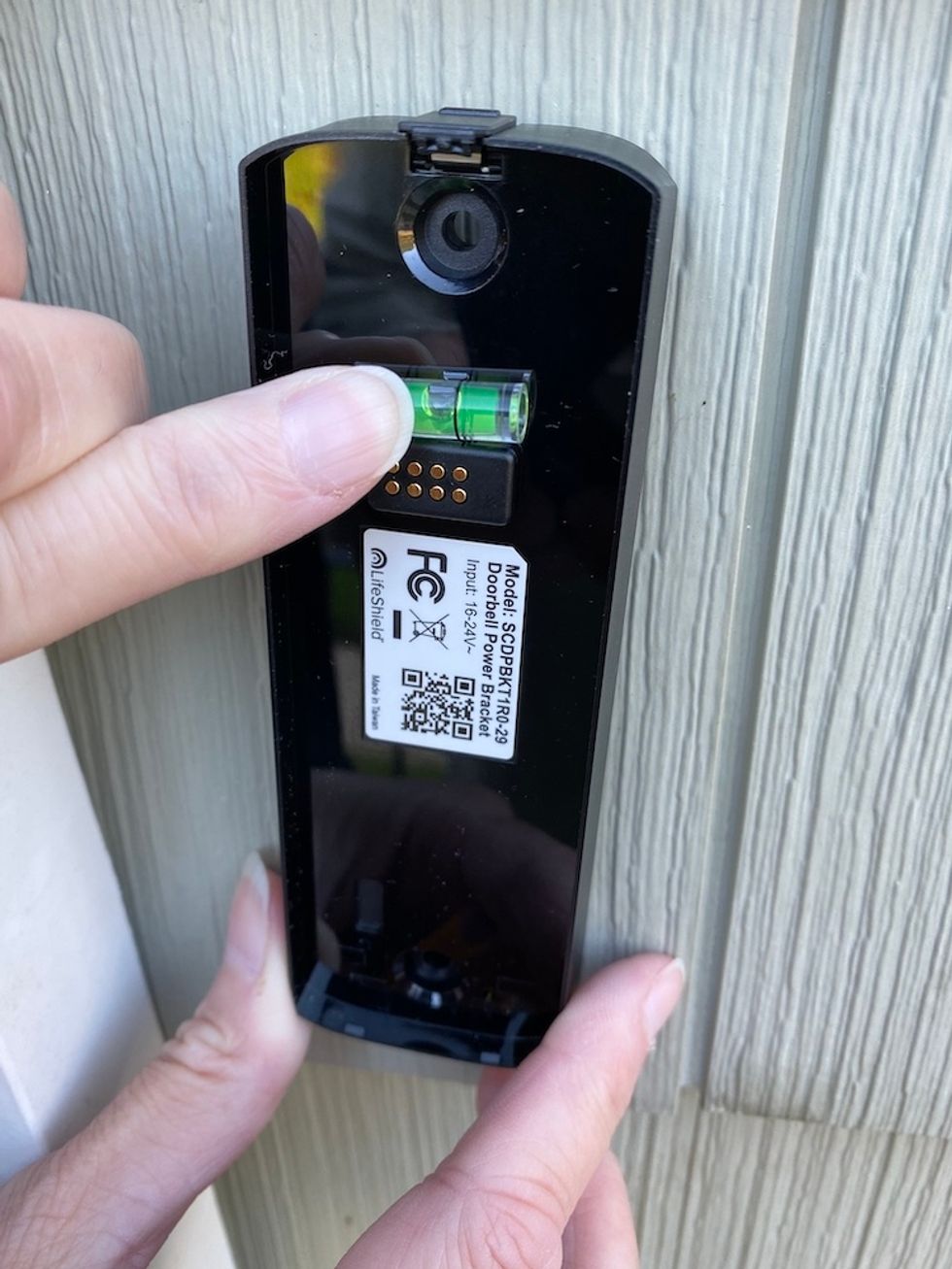 Photo of updside down mounting bracket with level.
