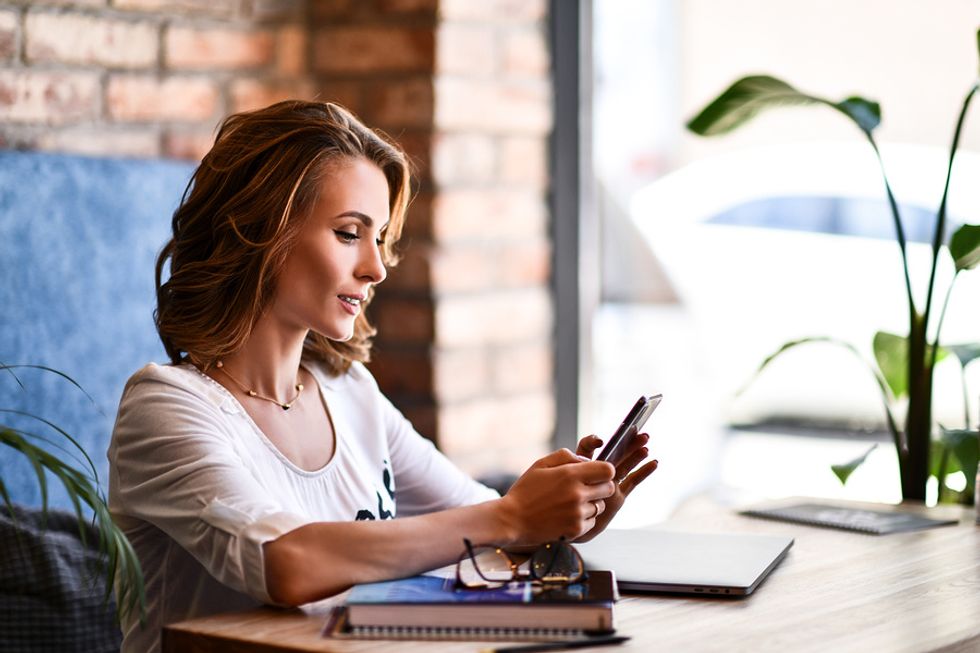 Businesswomen interacts on LinkedIn with people in her professional network.