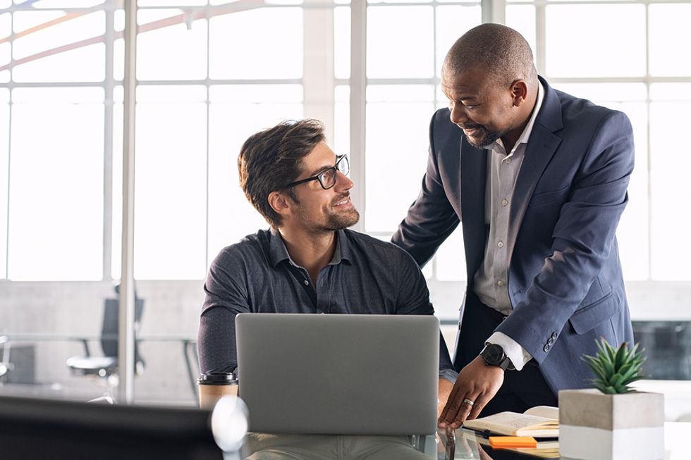 An employee asks an executive about a company decision