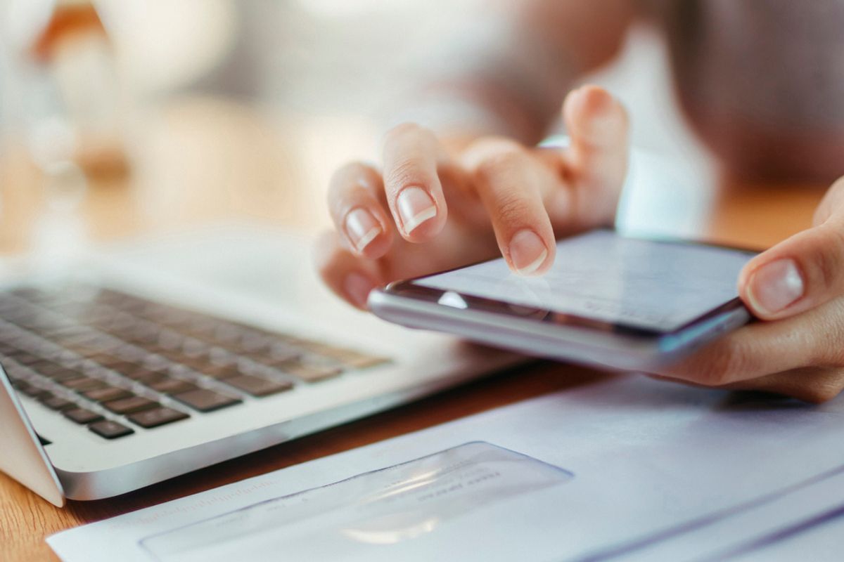 Stock image of a smartphone and laptop