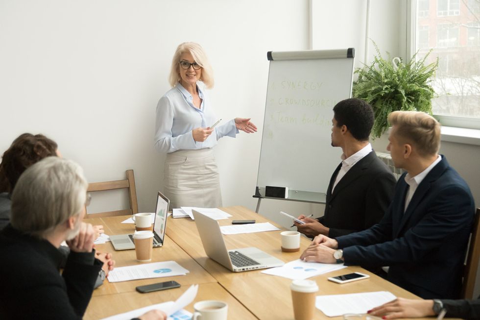 Senior professional woman promoting her abilities at work
