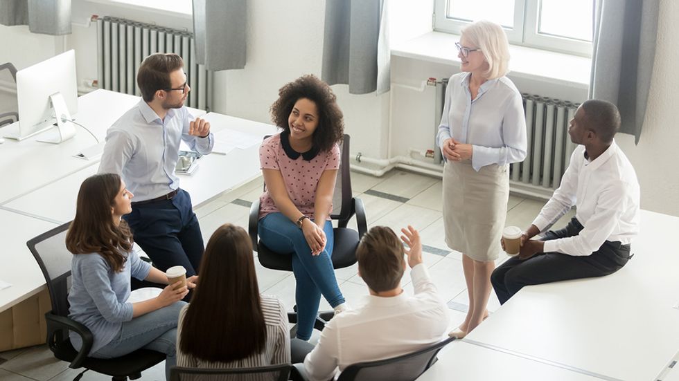 Company with great workplace culture has a meeting to discuss employee performance