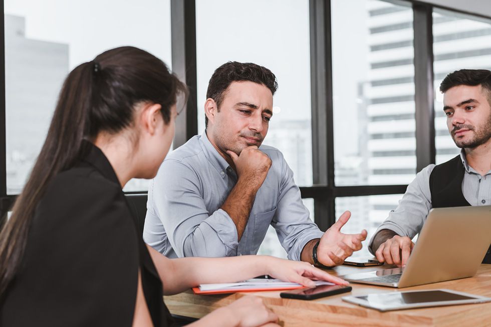 Co-workers have a meeting to talk about workplace culture