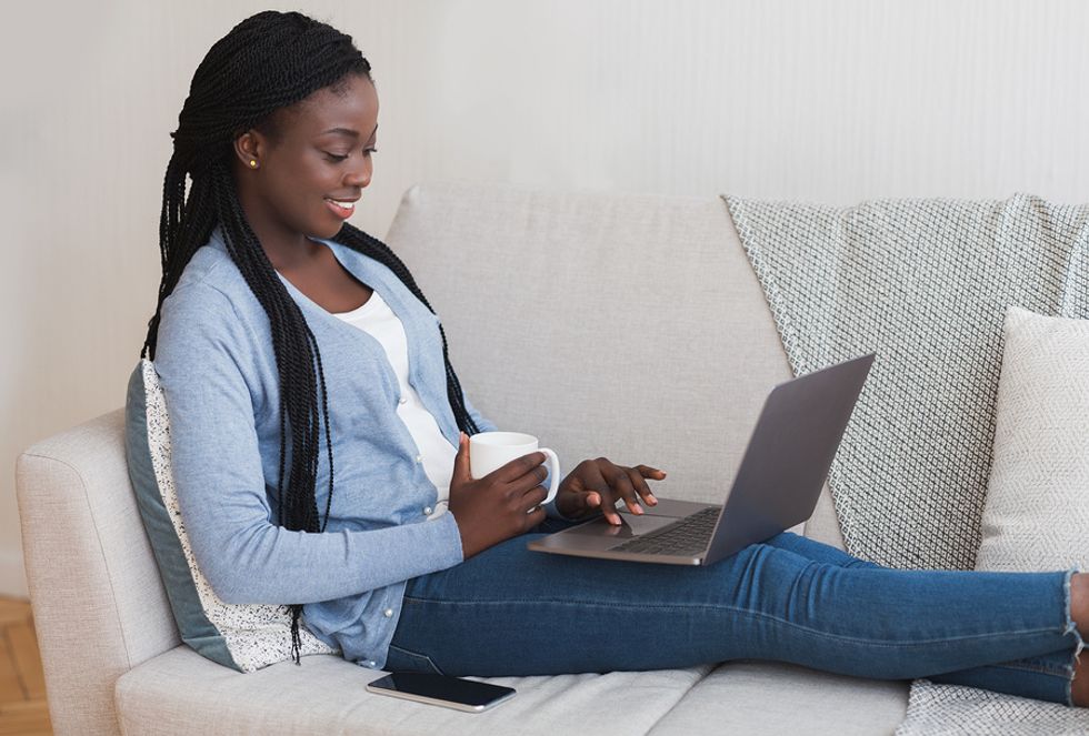 A young job seeker uses the Internet to view the current job openings.