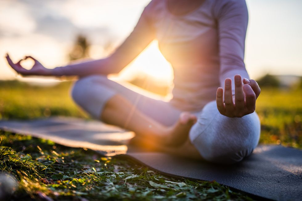 Stock image of a woman meditating