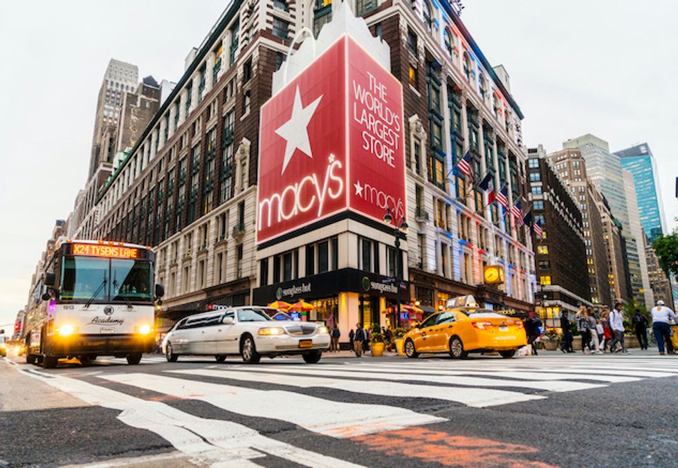 The Macy's flagship store in New York City with cars flying past