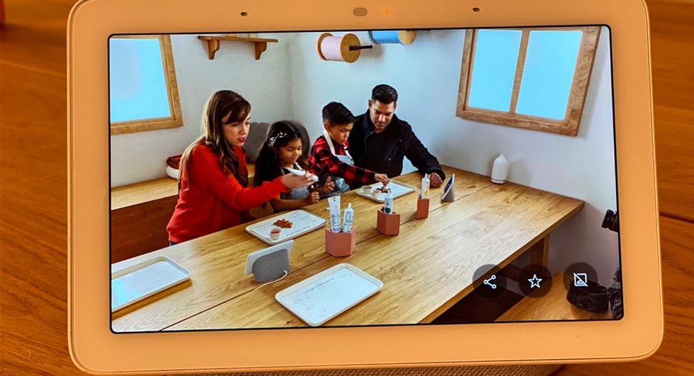 Family dining together shown on a smart display.