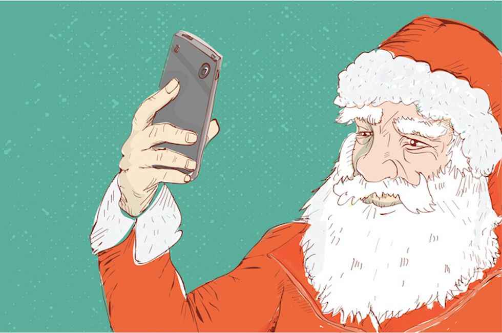 portrait of santa claus with cell phone
