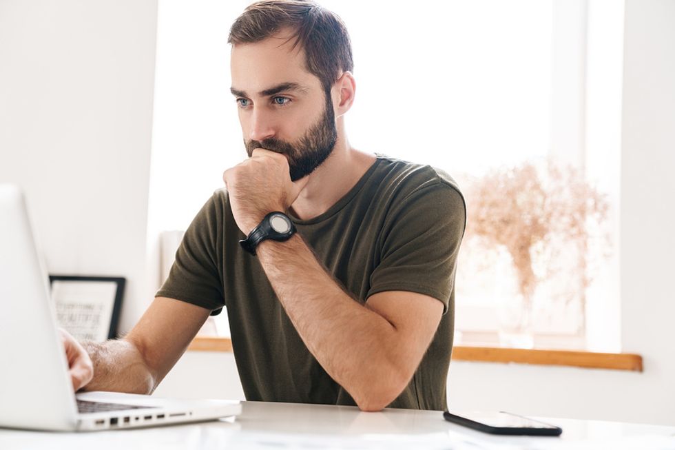 Man optimizing his LinkedIn profile to stand out to recruiters