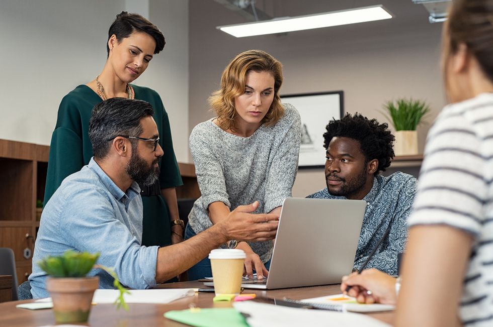 Managers lead their team with transparency during a meeting