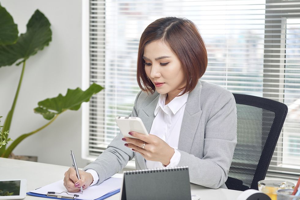 Executive monitoring her results as she manages in a new industry