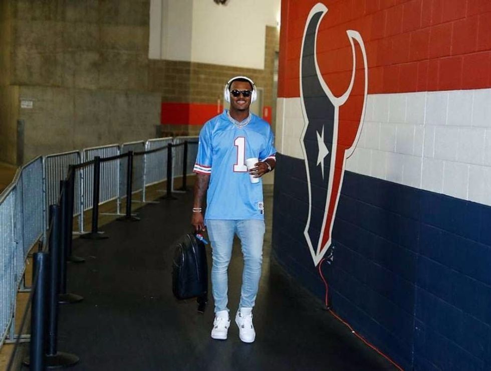 Deshaun Watson wearing a Warren Moon jersey