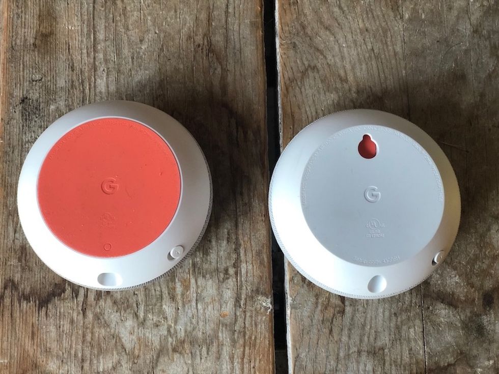 The Google Home Mini next to a Nest Mini