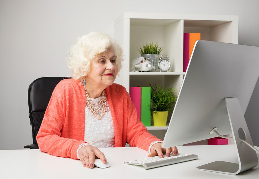 Older professional updates her resume in order to keep it current with the times.